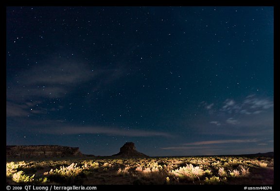 Night landscape with lighted canyon floor. Chaco Culture National Historic Park, New Mexico, USA (color)