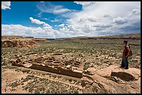 Man overlooking Chetro Ketl. Chaco Culture National Historic Park, New Mexico, USA