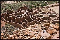 Tourists inspecting the complex room arrangement of Pueblo Bonito. Chaco Culture National Historic Park, New Mexico, USA