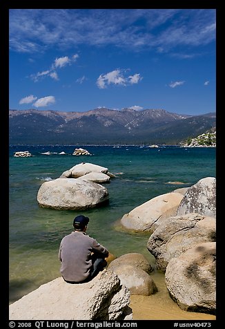 Man sitting on boulder, Sand Harbor, Lake Tahoe-Nevada State Park, Nevada. USA (color)