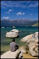 Man sitting on boulder, Sand Harbor, Lake Tahoe-Nevada State Park, Nevada. USA