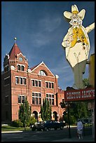 Giant Cactus Jack sign and brick building. Carson City, Nevada, USA (color)