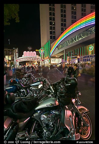 Harley-Davidson motorcycles on downtown street at night. Reno, Nevada, USA