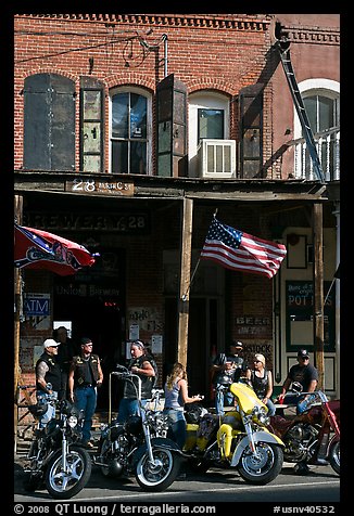 Motorcycles parked in front of brick historic building. Virginia City, Nevada, USA (color)