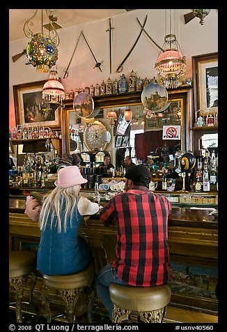 Man and woman sitting in saloon. Virginia City, Nevada, USA (color)