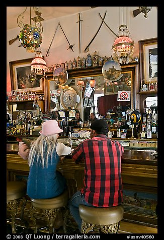 Man and woman sitting in saloon. Virginia City, Nevada, USA