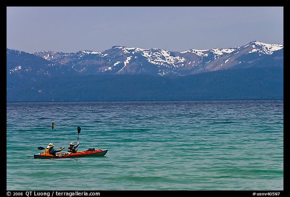 Kayak, turquoise waters and snowy mountains, East Shore, Lake Tahoe, Nevada. USA