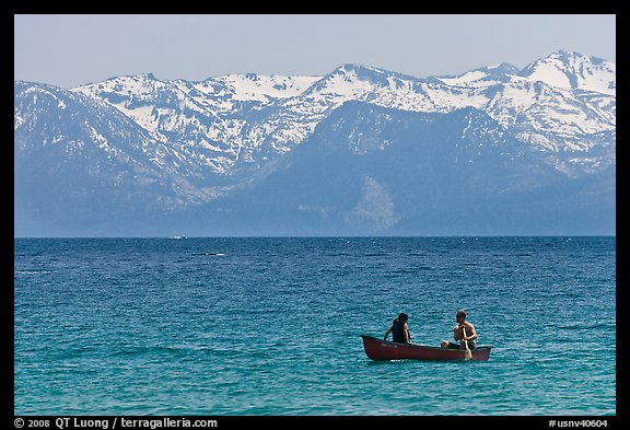 Canoe and snowy mountains, Lake Tahoe, Nevada. USA (color)