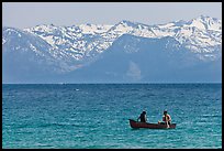 Canoe and snowy mountains, Lake Tahoe, Nevada. USA