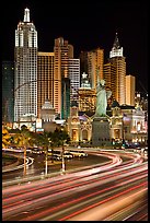 Traffic light trails and New York New York casino at night. Las Vegas, Nevada, USA (color)