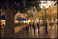 Man and woman standing on plaza inside Paris casino. Las Vegas, Nevada, USA