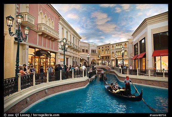 Gondolas and Grand Canal bordered by shops in the Venetian casino. Las Vegas, Nevada, USA