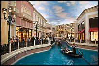 Gondolas and Grand Canal bordered by shops in the Venetian casino. Las Vegas, Nevada, USA (color)