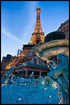 Fountain and Eiffel Tower replica at dusk, Paris casino. Las Vegas, Nevada, USA (color)