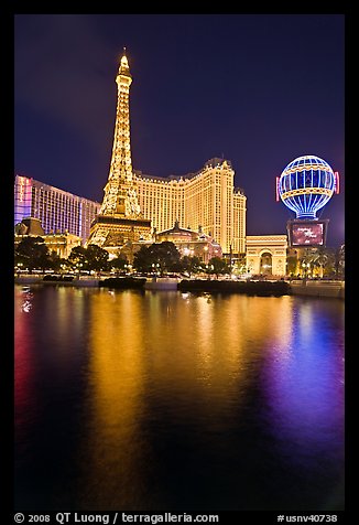 Paris Casino and Eiffel Tower reflected at night. Las Vegas, Nevada, USA