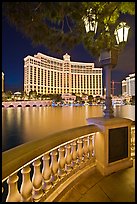 Lamp, reflection lake, and Bellagio hotel at night. Las Vegas, Nevada, USA (color)
