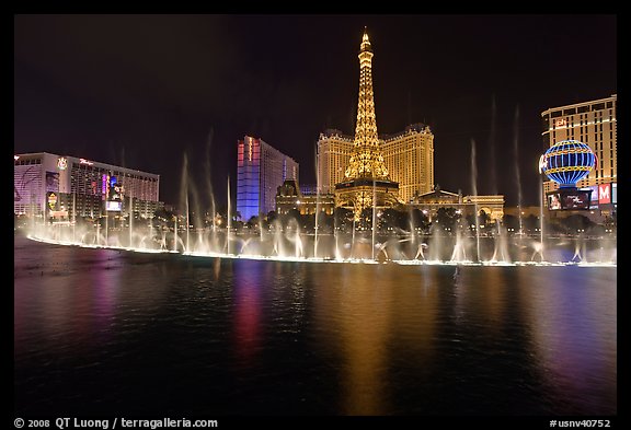 Bellagio dancing fountains and casinos reflected in lake. Las Vegas, Nevada, USA