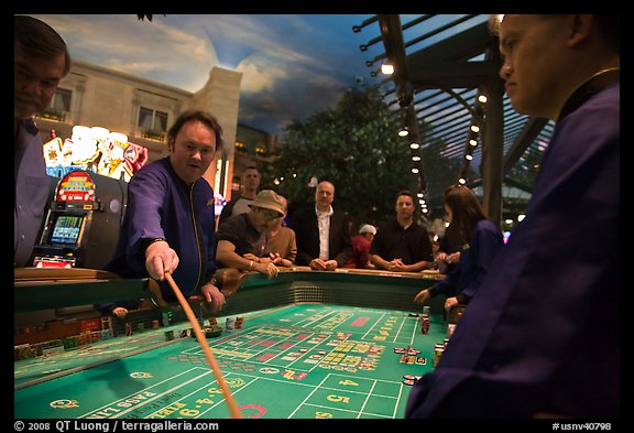 Dealer collecting during Craps game. Las Vegas, Nevada, USA (color)