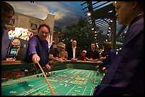 Dealer collecting during Craps game. Las Vegas, Nevada, USA ( color)