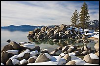 Snow and boulders on shore, Sand Harbor, Lake Tahoe-Nevada State Park, Nevada. USA