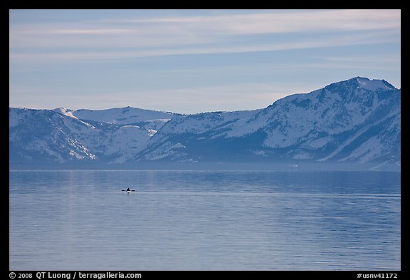 Kayak in the distance and mountains in winter, Lake Tahoe, Nevada. USA