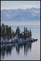 Cabin on lakeshore and snowy mountains, Lake Tahoe, Nevada. USA (color)