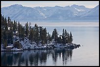 Lakeshore with houses and snow-covered mountains, Lake Tahoe, Nevada. USA (color)