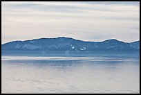 Distant mountains on lake rim in winter, Lake Tahoe, Nevada. USA