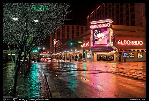 Main street with night reflections on wet pavement. Reno, Nevada, USA