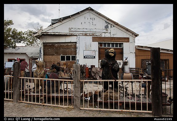 Wood sculptures and weathered building, Gerlach. Nevada, USA