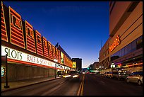 Casinos bordering street at dusk. Reno, Nevada, USA (color)