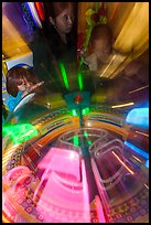 Arcade game light sweeps around players. Reno, Nevada, USA (color)