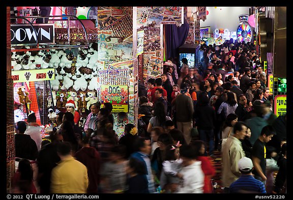 Holiday crowds in carnival game area. Reno, Nevada, USA (color)