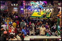 Families crowd arcade during holidays. Reno, Nevada, USA (color)