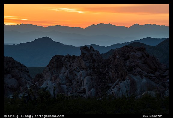 Whitney Pocket rocks and mountain ranges at sunset. Gold Butte National Monument, Nevada, USA (color)