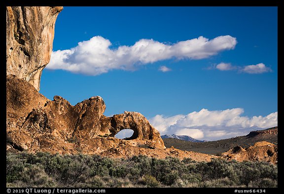 Natural arch and clouds. Basin And Range National Monument, Nevada, USA (color)