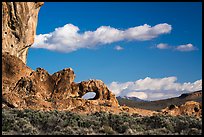 Natural arch and clouds. Basin And Range National Monument, Nevada, USA ( color)