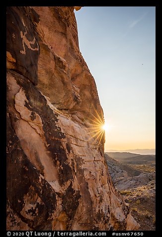 Cliff with Falling Man petroglyph and sun. Gold Butte National Monument, Nevada, USA (color)
