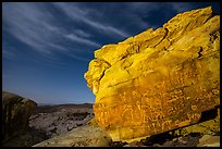 Rock with petroglyphs at night with clouds. Gold Butte National Monument, Nevada, USA ( color)