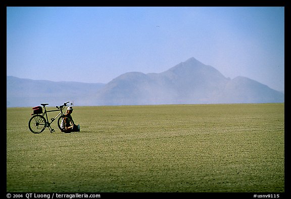 Bicyclist on the desert Playa, Black Rock Desert. Nevada, USA