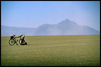 Bicyclist on the desert Playa, Black Rock Desert. Nevada, USA