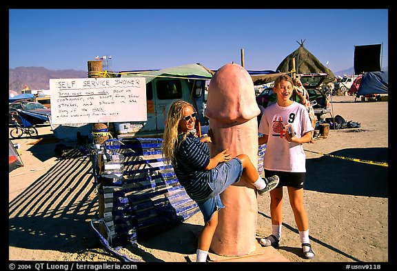 Phallic shower during the Burning Man festival. Nevada, USA (color)