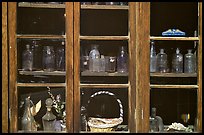 Old bottles in a store window, Austin. Nevada, USA (color)