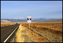 Sign reading Loneliest road in America. Nevada, USA (color)