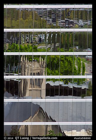 Church reflected in glass building. Houston, Texas, USA (color)