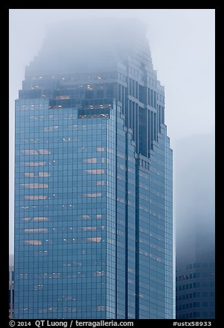 Top of skyscrapers capped in clouds. Houston, Texas, USA (color)