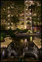 Waterfall, elegant couple in distance. San Antonio, Texas, USA ( color)