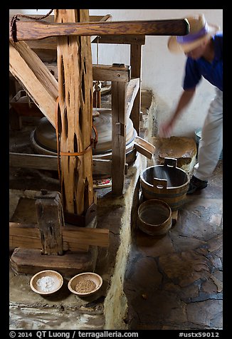 Man operating mill, Mission San Jose. San Antonio, Texas, USA