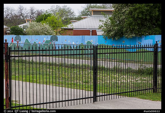 Fence with landscape mural decor. San Antonio, Texas, USA (color)