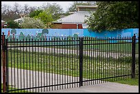 Fence with landscape mural decor. San Antonio, Texas, USA ( color)